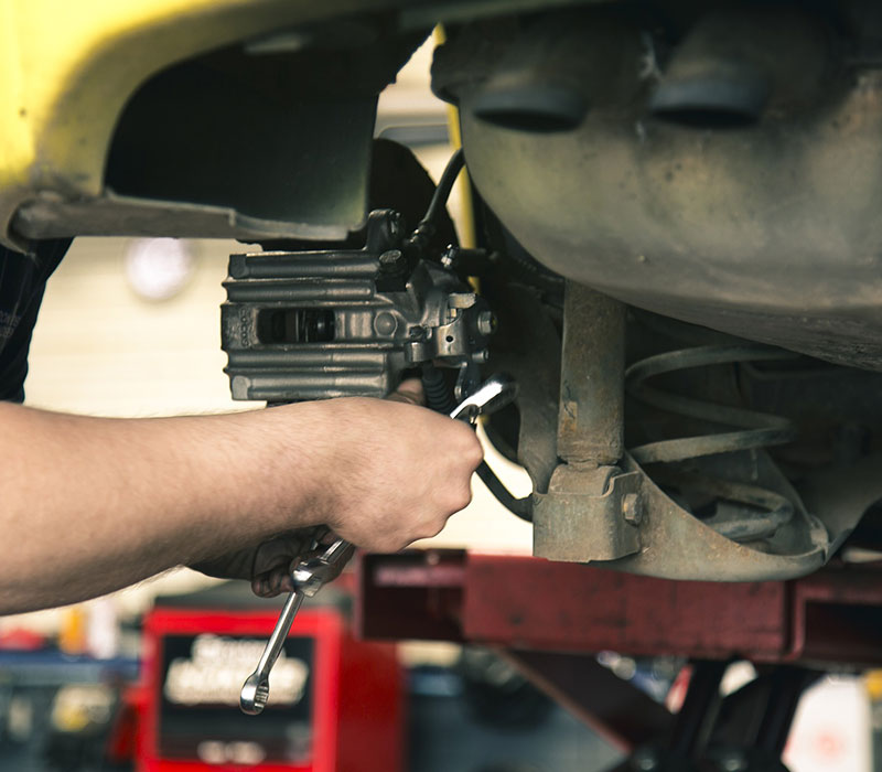 mechanics hand during a brake job